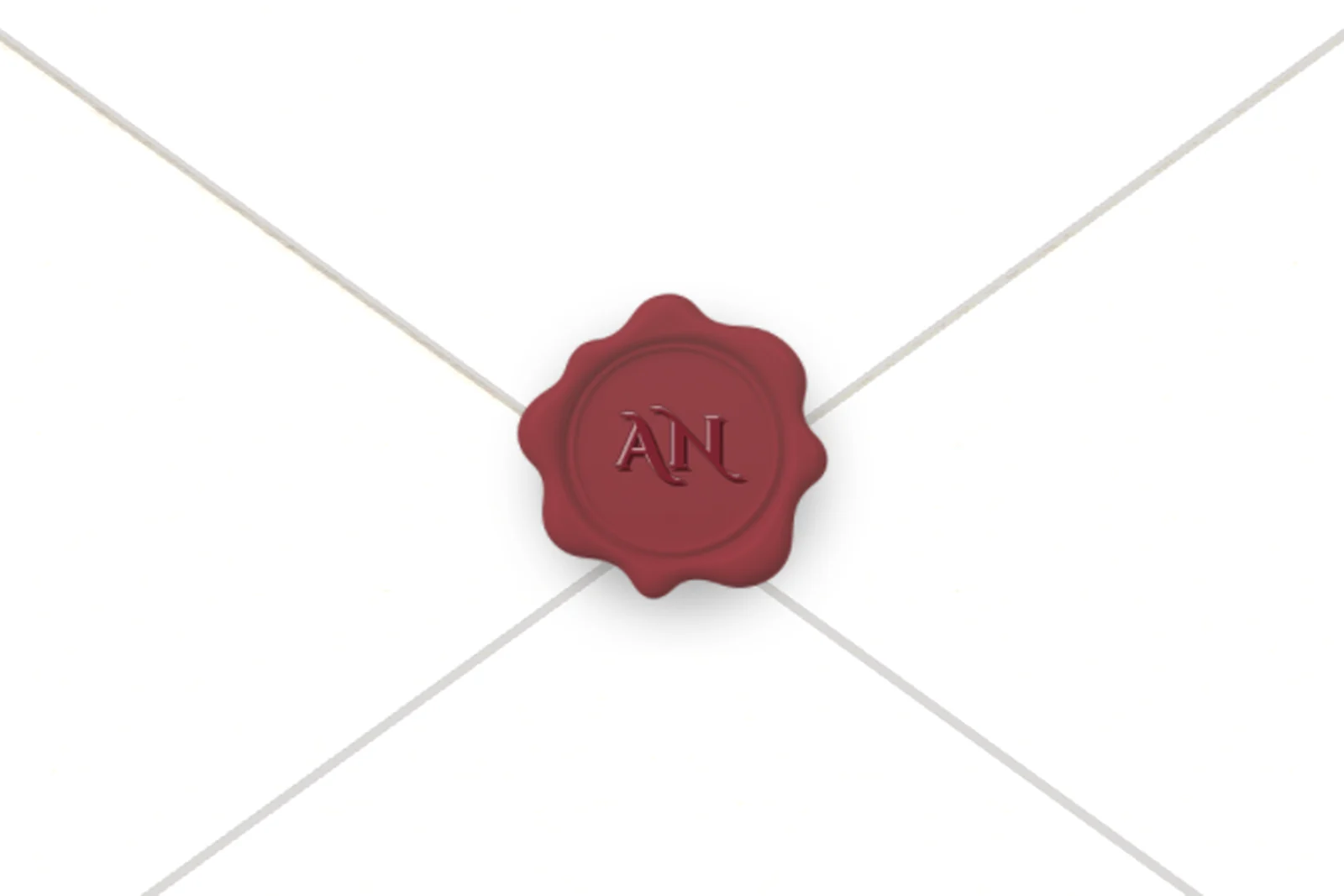 A burgundy wax seal on an ivory envelope